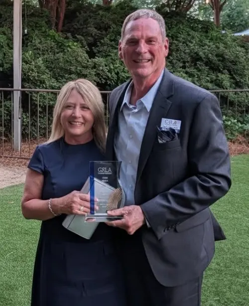 Eric Butler, Executive Director of Manor Lake Athens, with the Hero Award